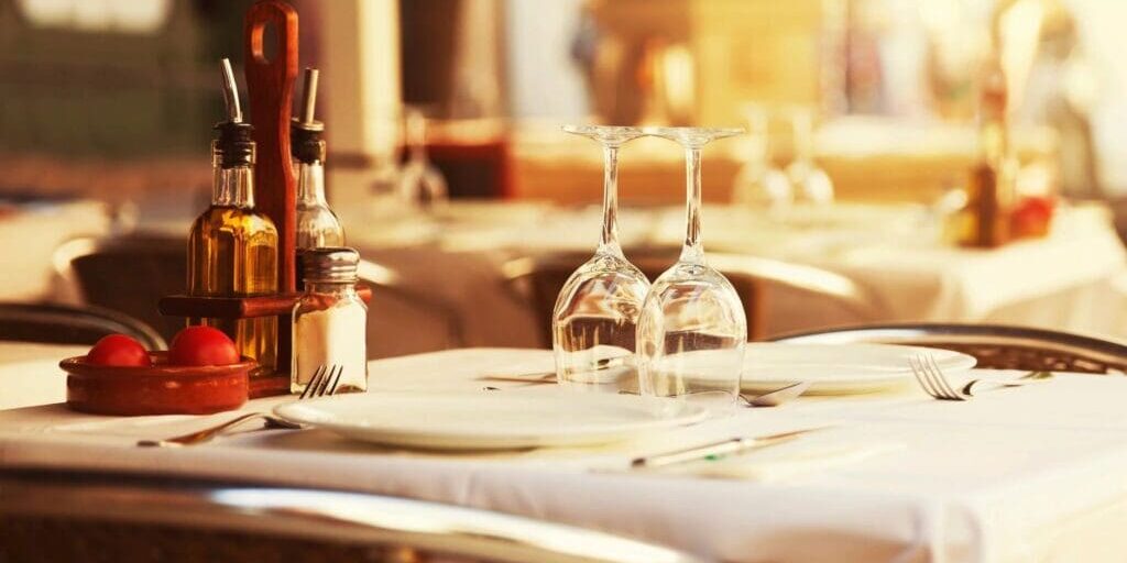 Restaurant in New York City Table with plates and liquor glasses